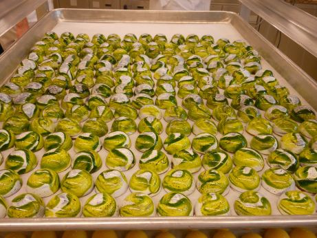 green swirls on chocolate shells